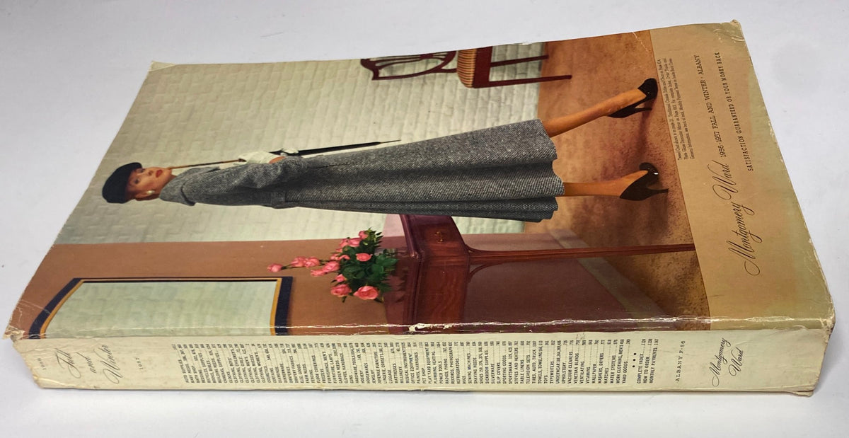 Side view of the 1956 - 1957 Montgomery Ward Fall and Winter Catalog showcasing a model in a fashionable wool coat, demonstrating the timeless style of the 1950s.