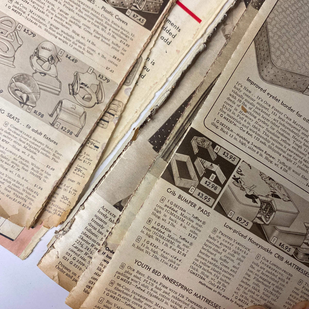 Additional interior view of baby products in the 1954 Sears Roebuck and Co. Fall and Winter Catalog, highlighting bumper pads and mattress options for children's furniture.
