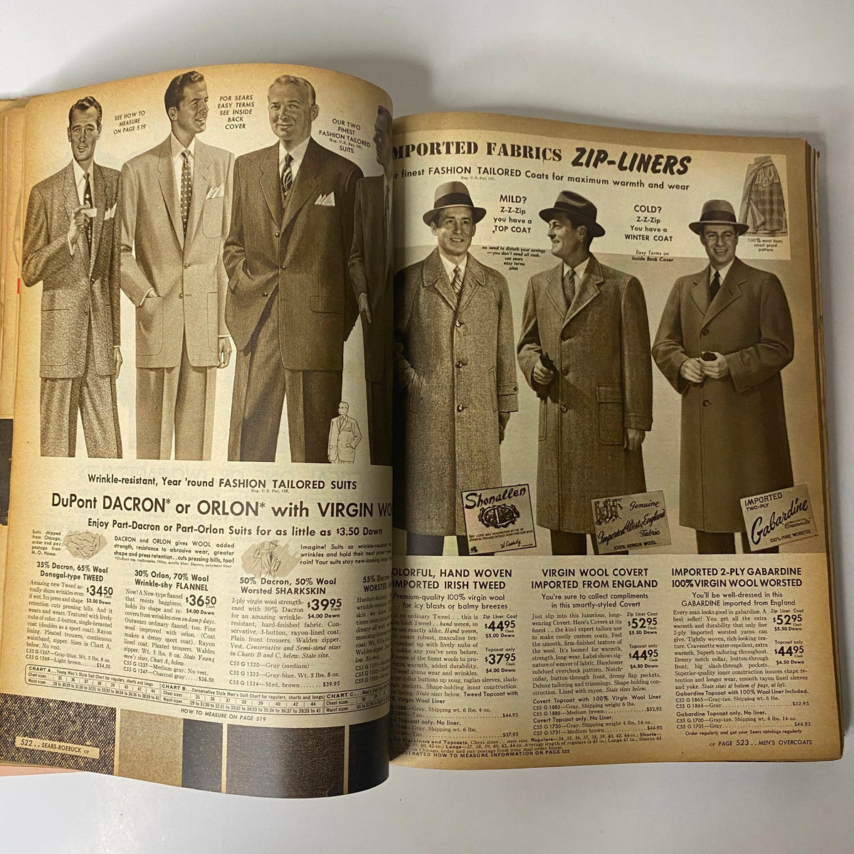 Interior page of the 1954 Sears Roebuck and Co. Fall and Winter Catalog highlighting tailored suits for men, featuring modern styles and fabrics, with prices starting at $3.50.