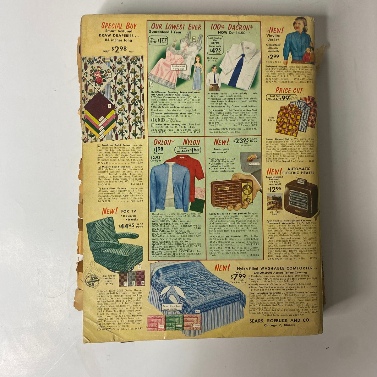 Back cover of the 1954 Sears Roebuck and Co. Fall and Winter Catalog displaying various products including draperies, dresses, and home appliances with their prices.