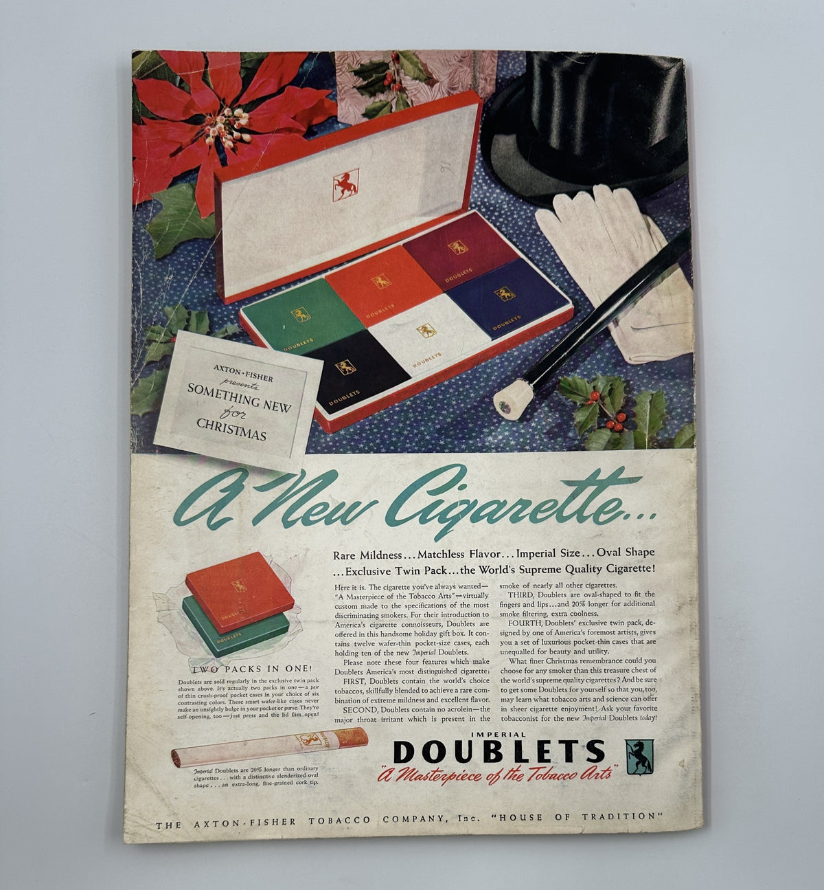 Esquire Magazine January 1942 Varga Esky Galatea Mickey Mouse Cover w Pinup; An advertisement for Doublets cigarettes presented in a festive, holiday-themed layout.