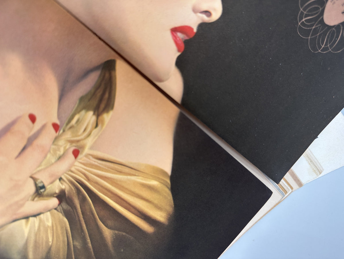 Close-up detail of the golden outfit worn by the woman in Esquire Magazine April 1942, emphasizing fashion and beauty details.