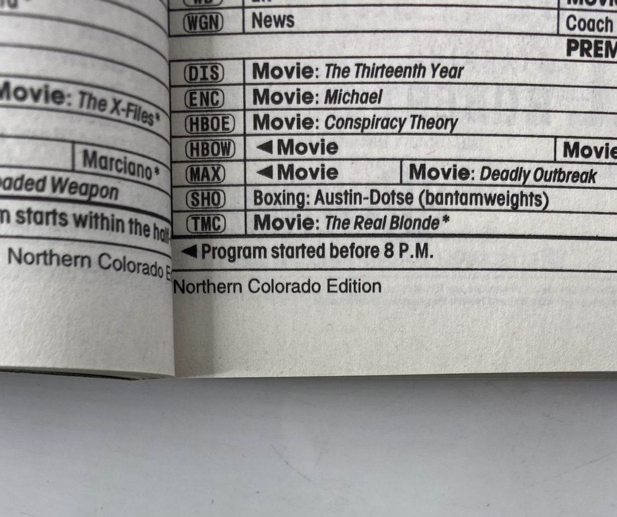 TV Guide Magazine May 15, 1999 interior page showing program listings including movies such as Michael and The Real Blonde, along with news and boxing updates.