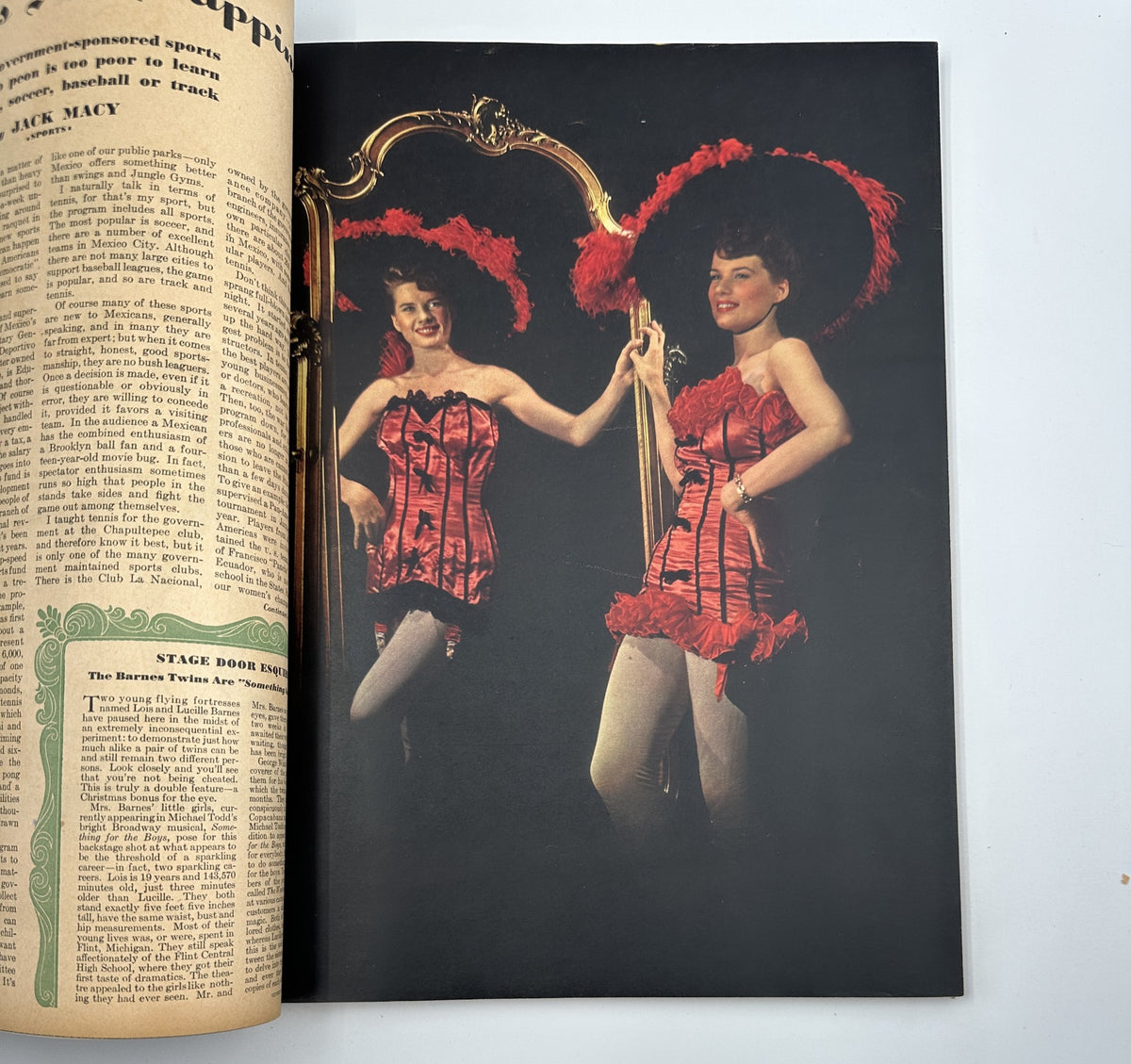 Esquire Magazine December 1943, photo of two women in vibrant red corsets and feathered hats, featured in the 'Stage Door Esquire' section, exemplifying the magazine's glamorous depiction of femininity.