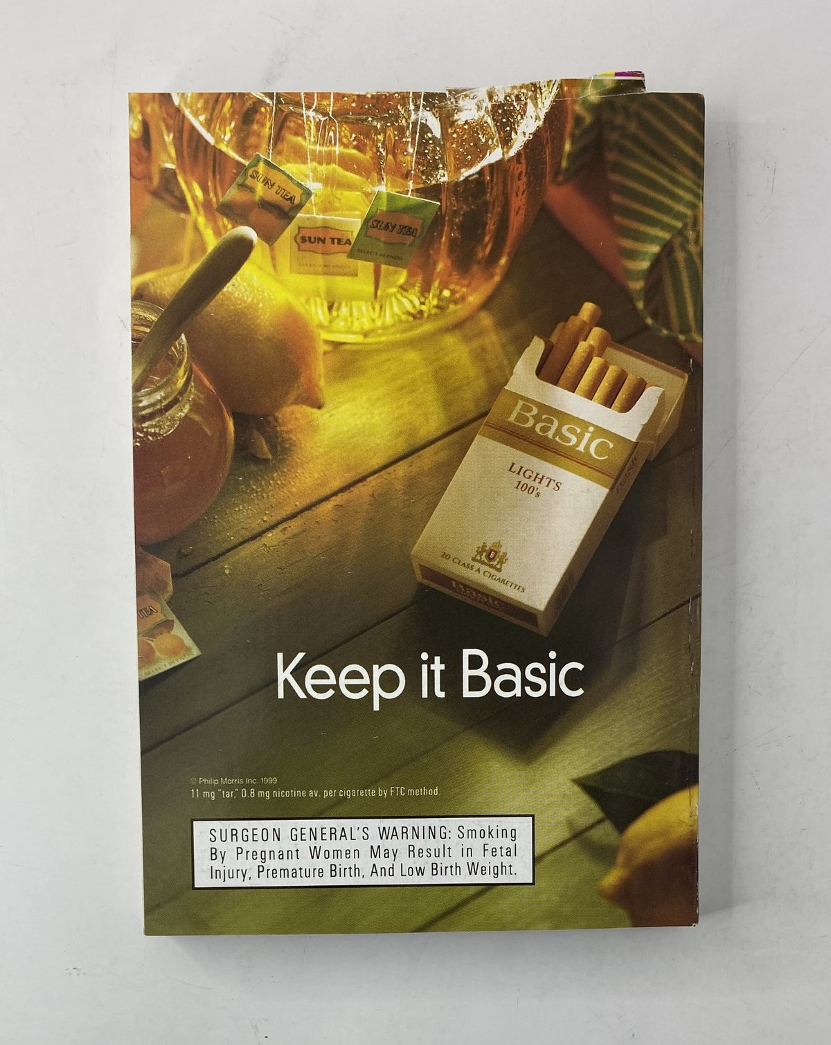 Cover of a vintage advertisement for Basic cigarettes, titled 'Keep it Basic', promoting smoking awareness and health warnings.