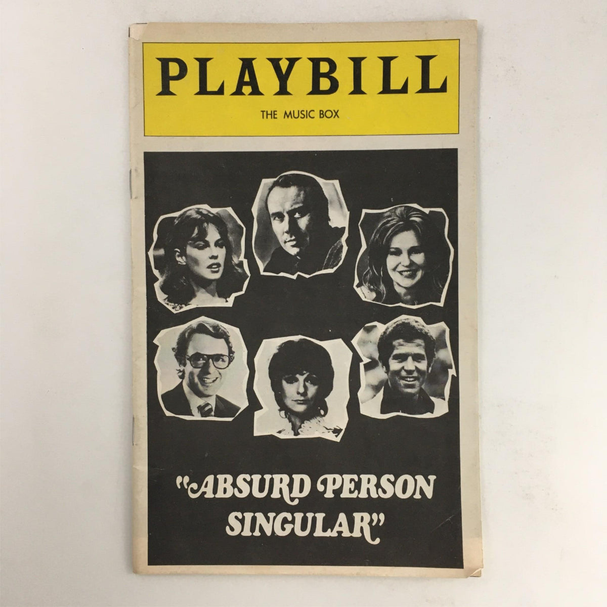 1975 Playbill for Absurd Person Singular by Eric Thompson at The Music Box featuring prominent cast images.