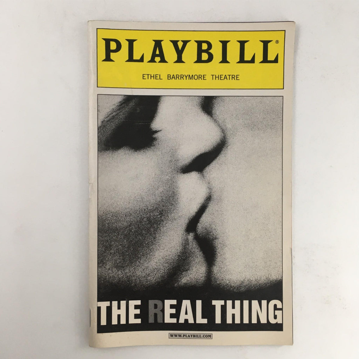 2000 Playbill for 'The Real Thing' by Tom Stoppard featuring a close-up black and white image, showcasing the theatrical production at Ethel Barrymore Theatre.