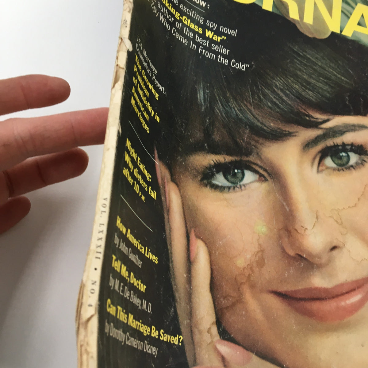 Side view of the Ladies' Home Journal Magazine April 1965 cover, showcasing a vintage photograph of Anne-Marie Barden and highlighting the magazine's wear and tear indicative of its age.