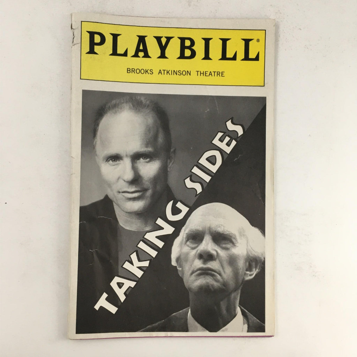 1996 Playbill for 'Taking Sides' by Ronald Harwood, featuring an image of Ed Harris and Daniel Massey, performed at Brooks Atkinson Theatre.