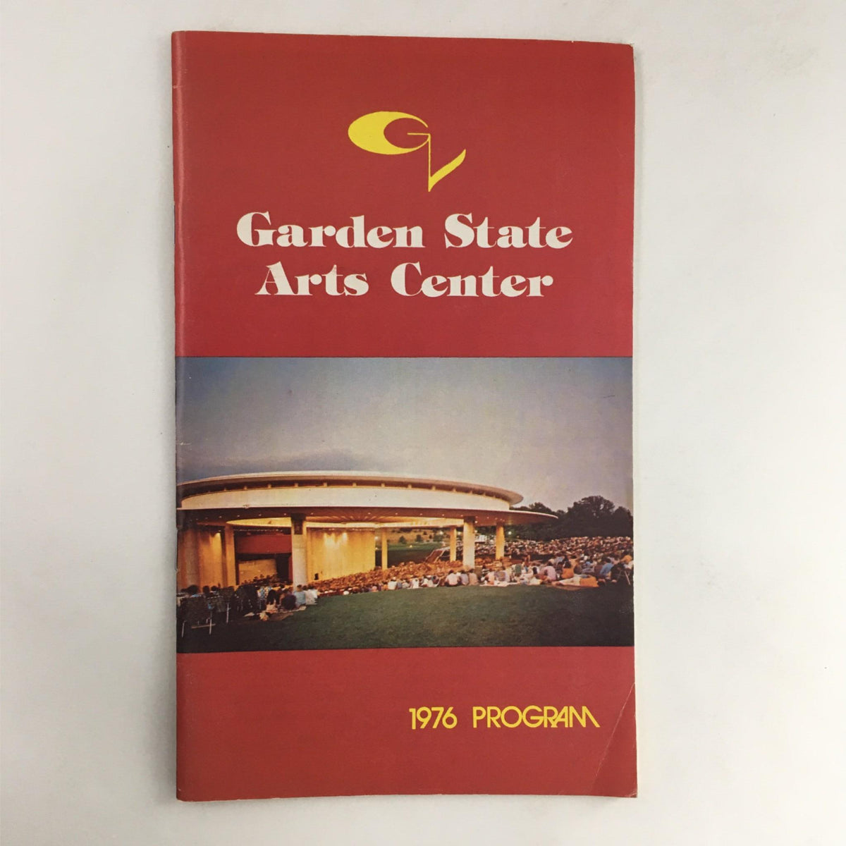1976 George Burns and Carol Channing at Garden State Arts Theater program cover featuring the Garden State Arts Center and a crowd, representing a historical artistic event.