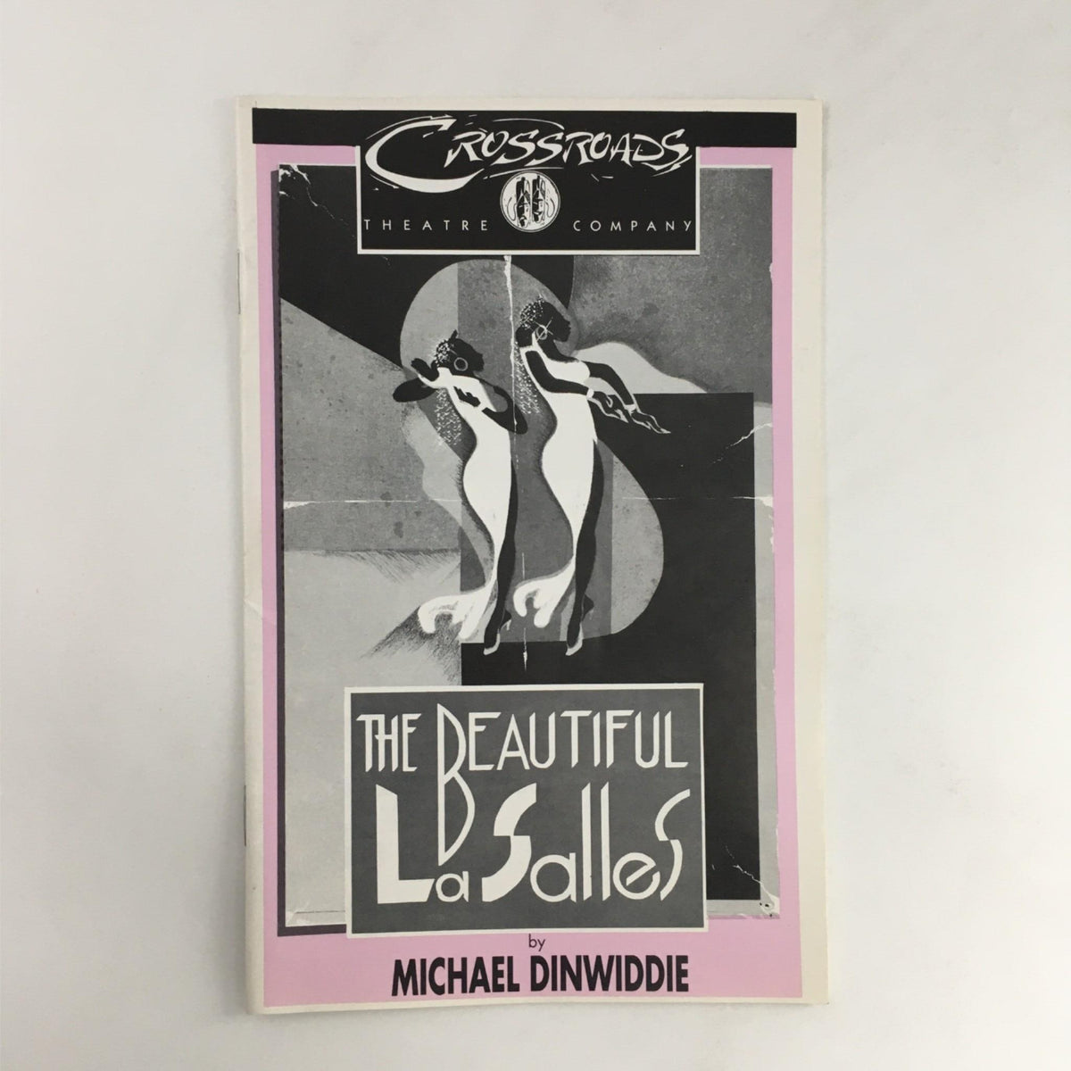 Cover of 'The Beautiful LaSalles' by Michael Dinwiddie, produced by Crossroads Theatre Company, featuring a vintage design with two elegantly dressed women.