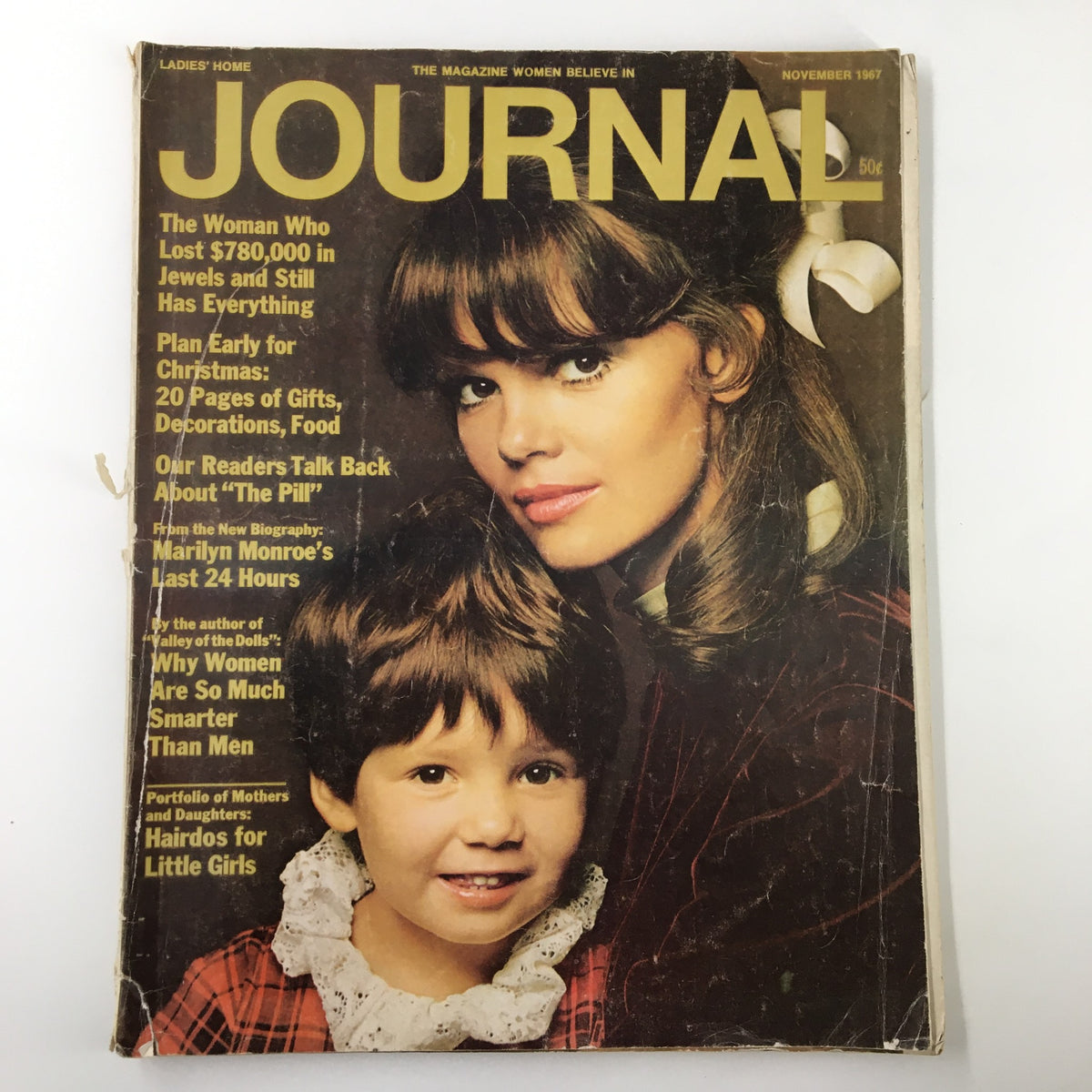 Cover of the Ladies' Home Journal Magazine, November 1967 issue, featuring a woman and a young girl, with bold yellow text highlighting key articles about Christmas planning and Marilyn Monroe.
