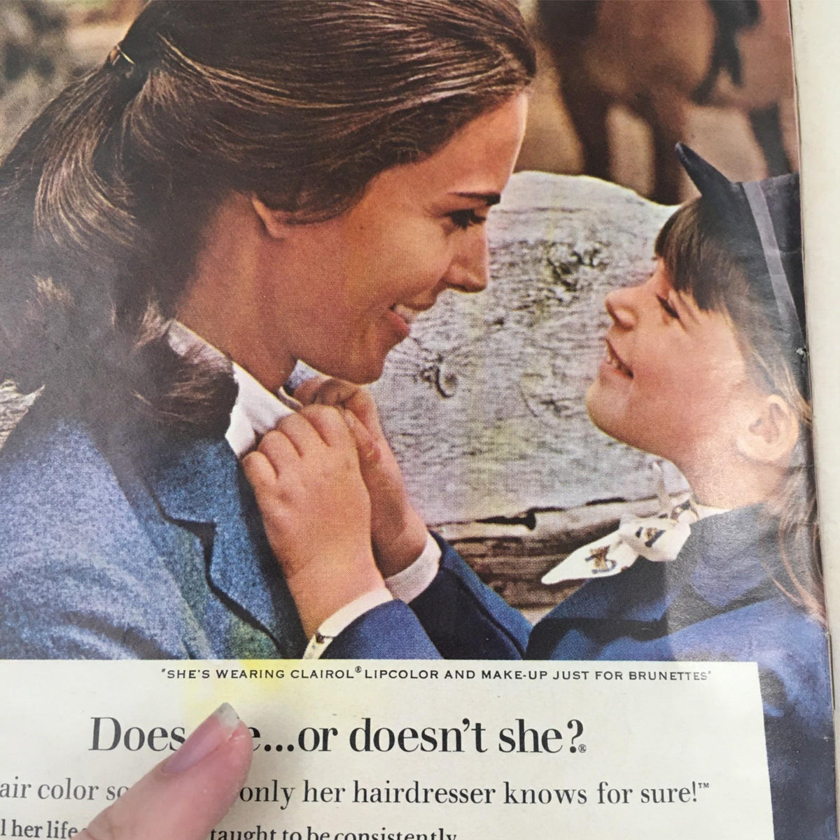 Vintage advertisement in the 1967 Playbill There's A Girl In My Soup featuring a mother and daughter, promoting Clairol hair products, reflecting 60s advertising culture.