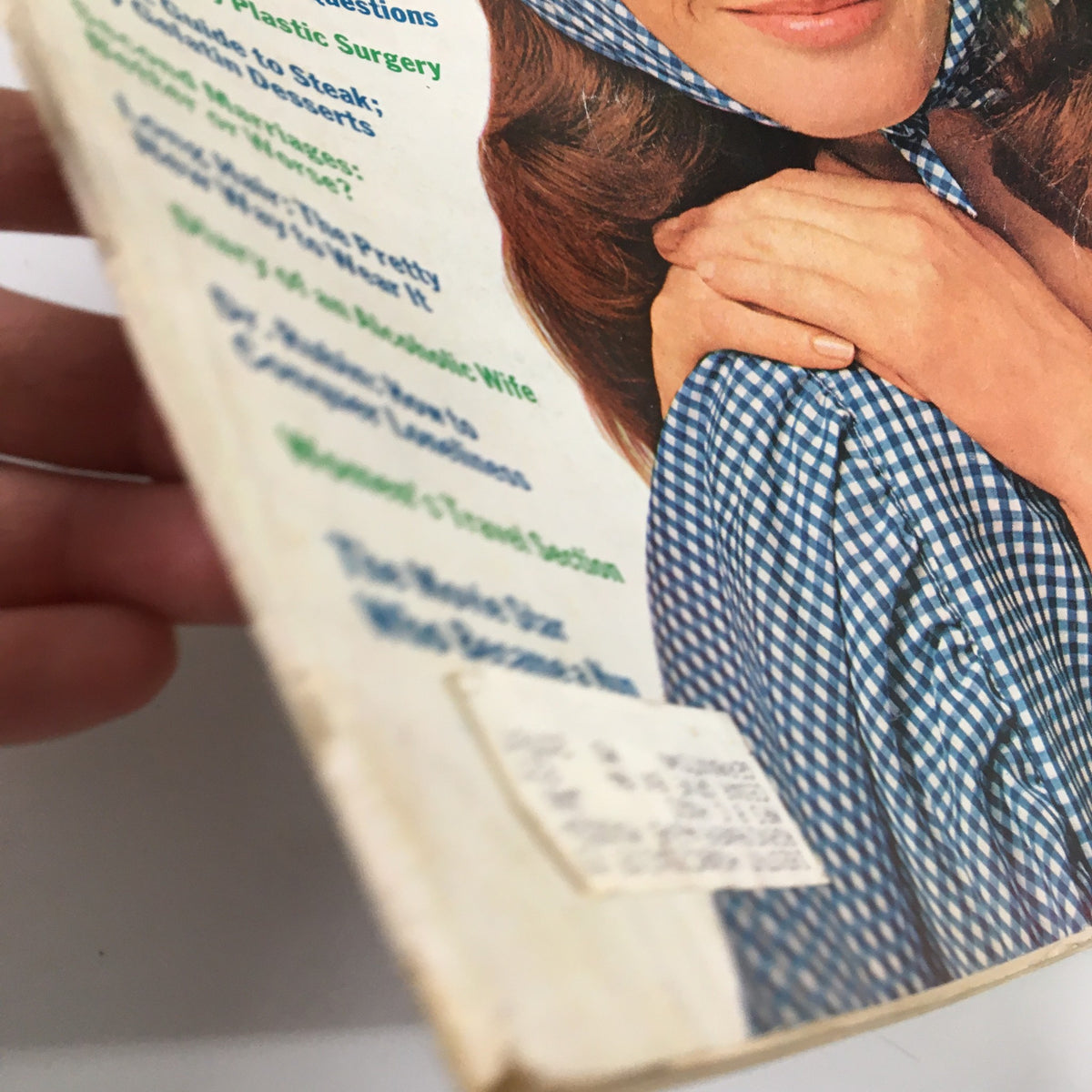 Side view of the Ladies' Home Journal Magazine May 1971, displaying the edge of the cover with a vintage label and highlights of prominent articles like 'Diary of an Alcoholic Wife' and more.