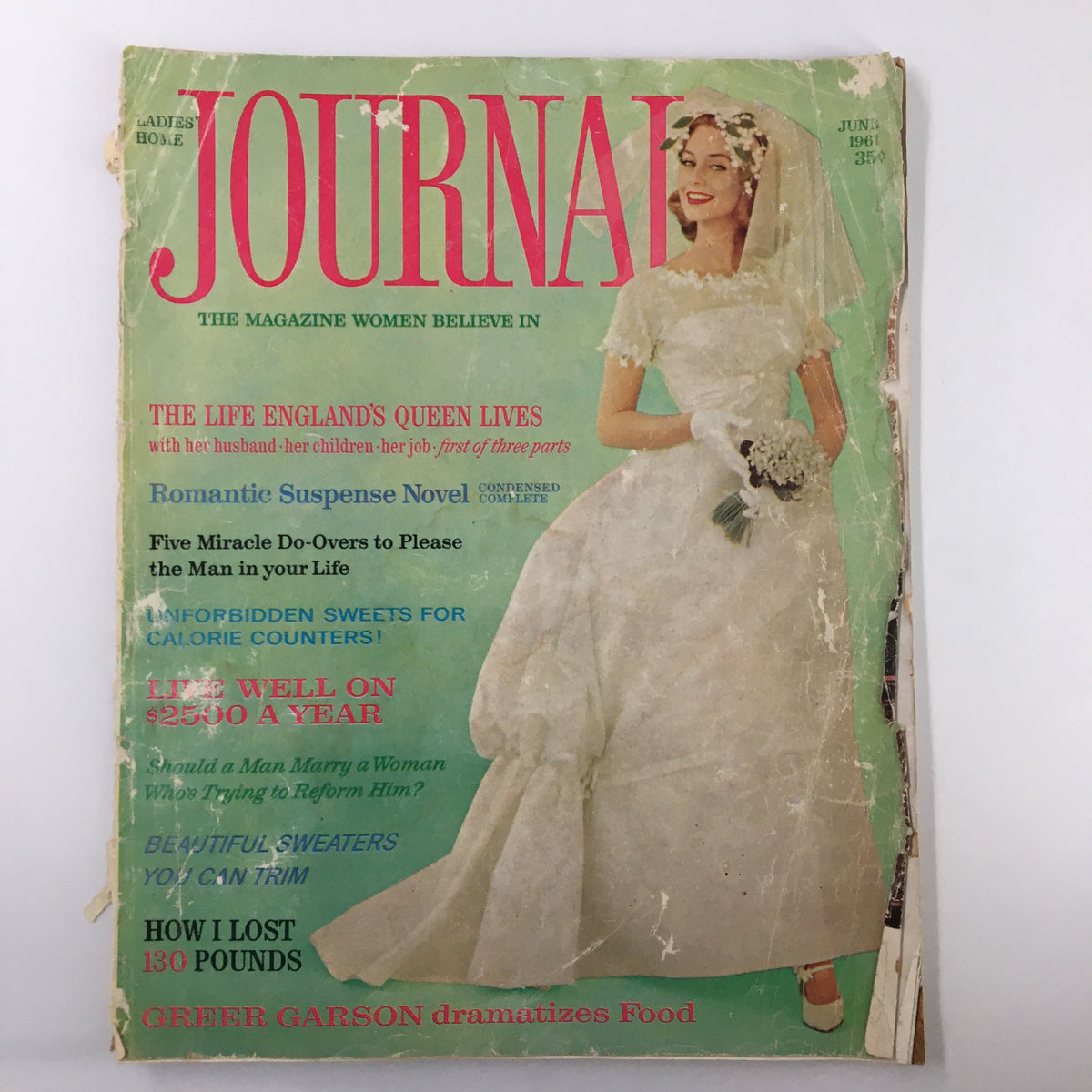 Ladies' Home Journal Magazine June 1961 cover featuring a smiling bride in a vintage wedding dress and veil, promoting the theme 'The Life England's Queen Lives'.
