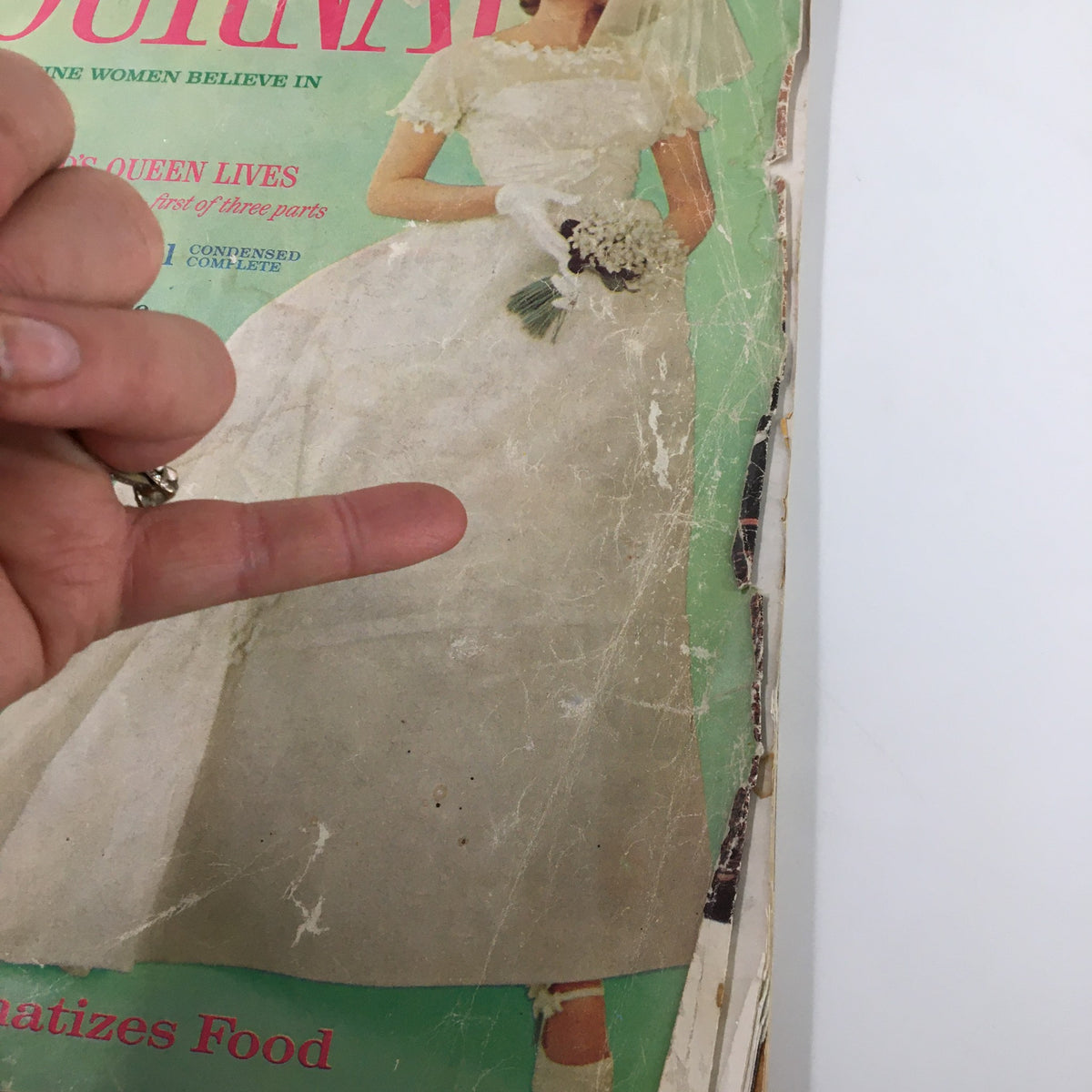 Close-up view of the Ladies' Home Journal Magazine June 1961 cover showing a bride with flowers, highlighting the title 'The Life England's Queen Lives'.