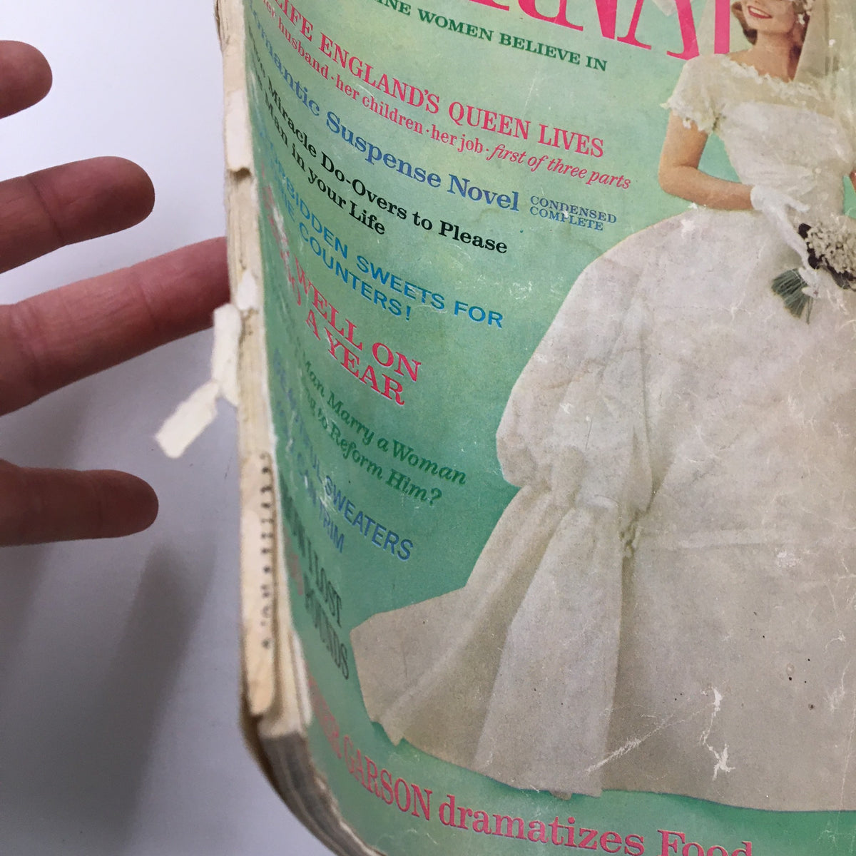 Side view of the Ladies' Home Journal Magazine June 1961, illustrating wear and tear, with the headline 'The Life England's Queen Lives' prominently displayed.