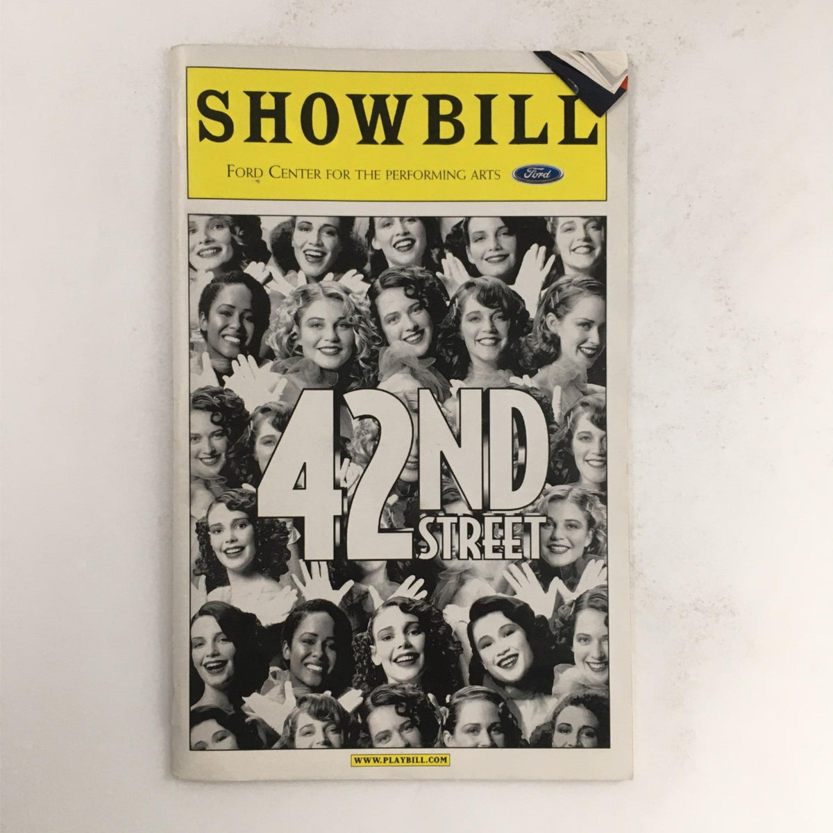 2001 Showbill for 42nd Street featuring a collage of smiling actresses, showcasing the Ford Center for the Performing Arts production.