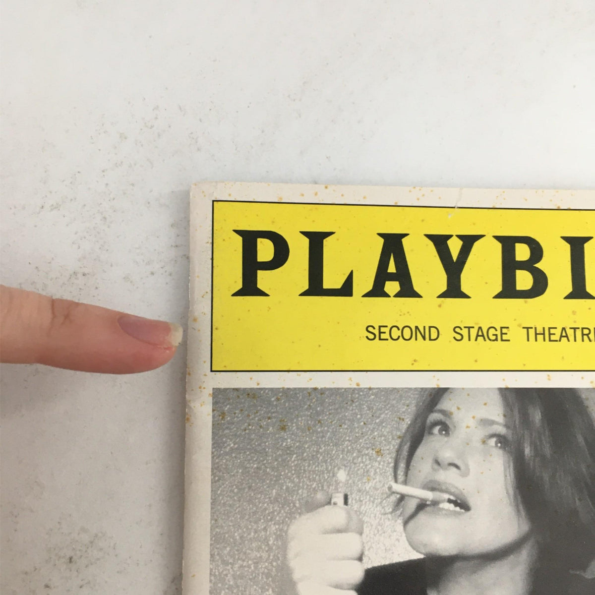 Detail view of the top left corner of the 2003 Playbill Little Fish by Michael John LaChiusa, displaying the Playbill logo and Second Stage Theatre branding.