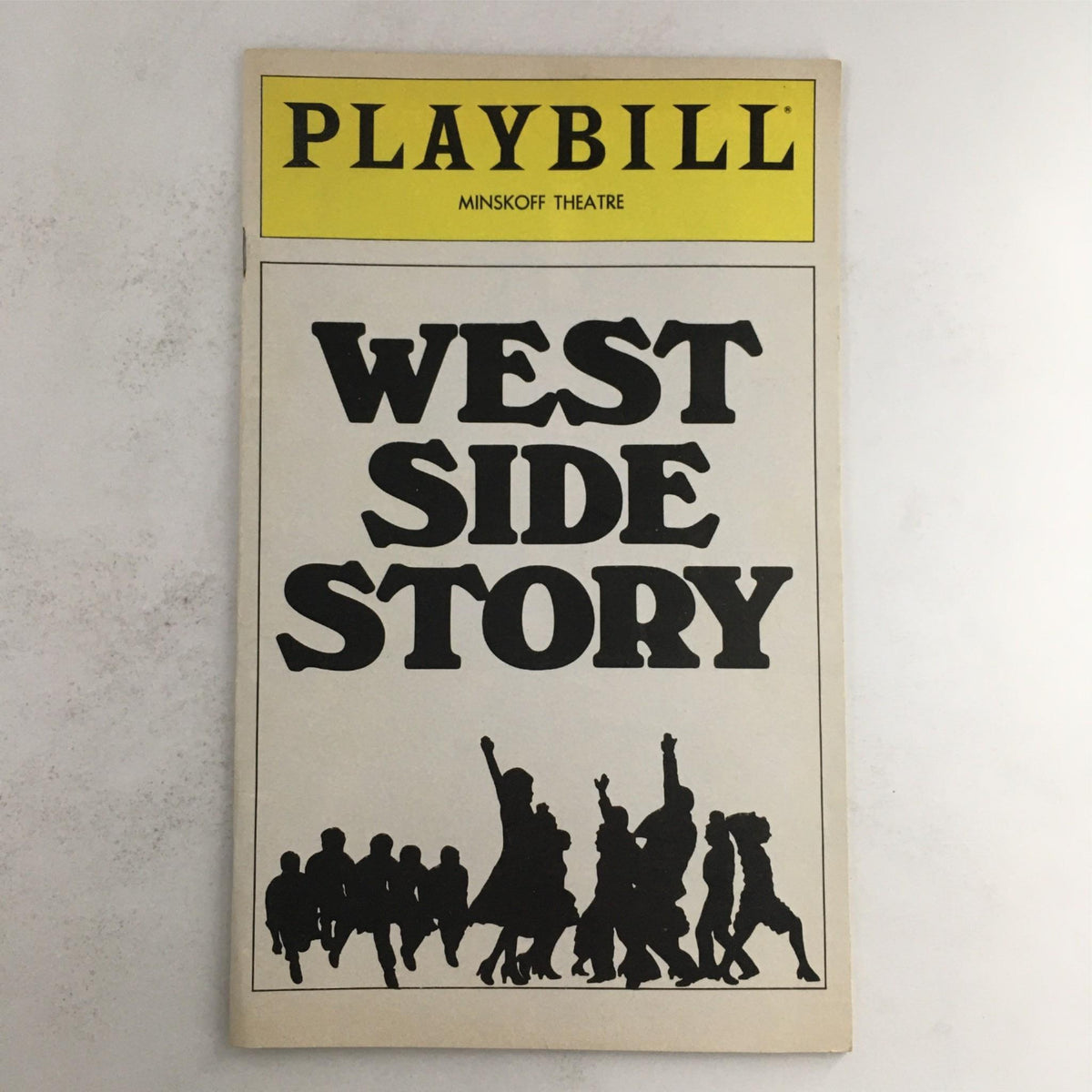 1980 Playbill for West Side Story by Jerome Robbins and Gerald Freedman at Minskoff Theatre featuring bold black text and dramatic silhouette imagery.
