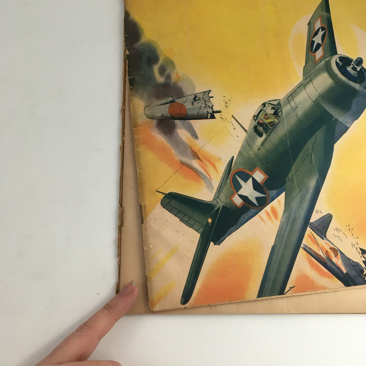 Cover of Model Airplane News Magazine January 1944 featuring an illustration of a vintage German Hellcat aircraft in flight, with dramatic background elements depicting war-like scenes.