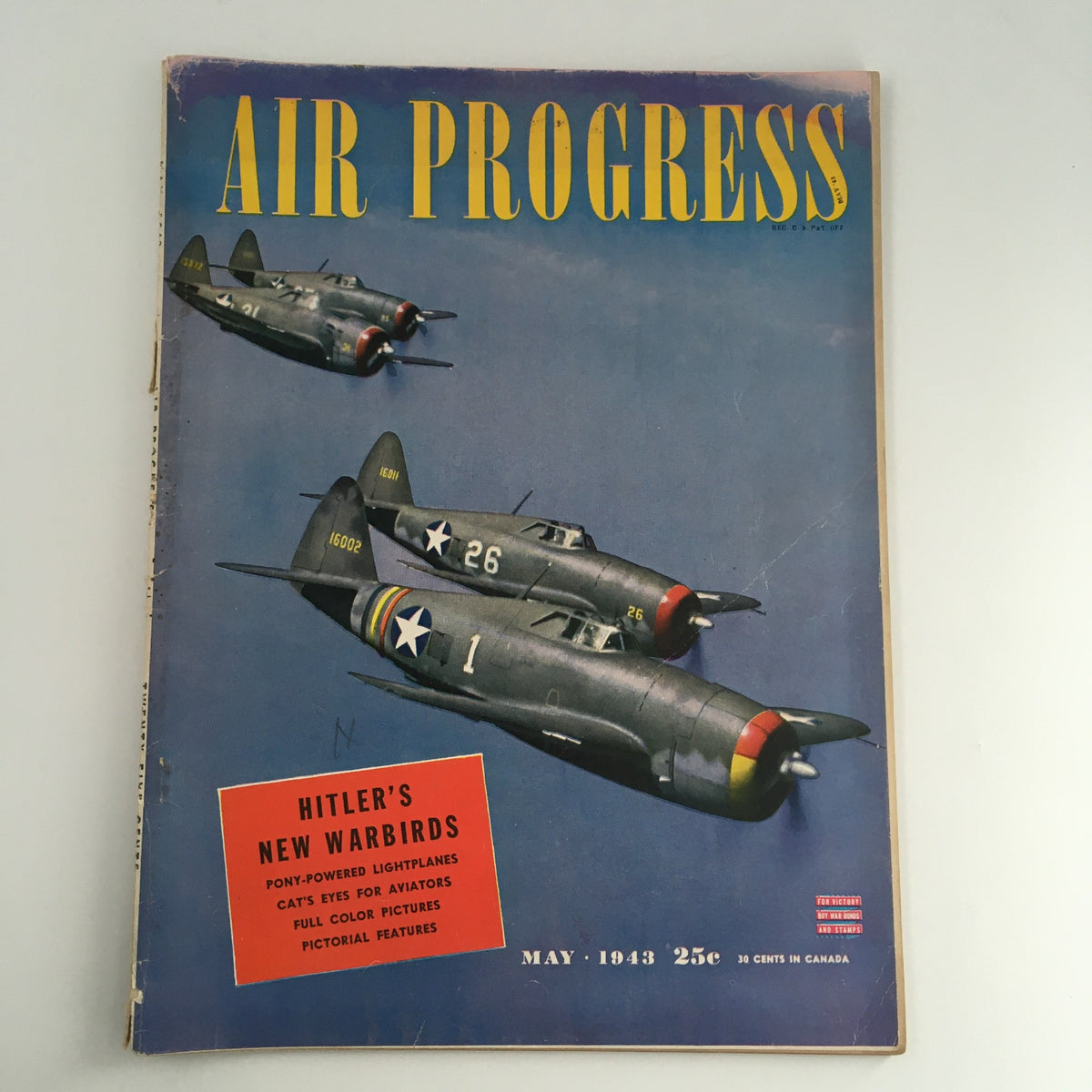 Cover of Air Progress Magazine May 1943 featuring 'Hitler's New Warbirds', showcasing military planes in flight.