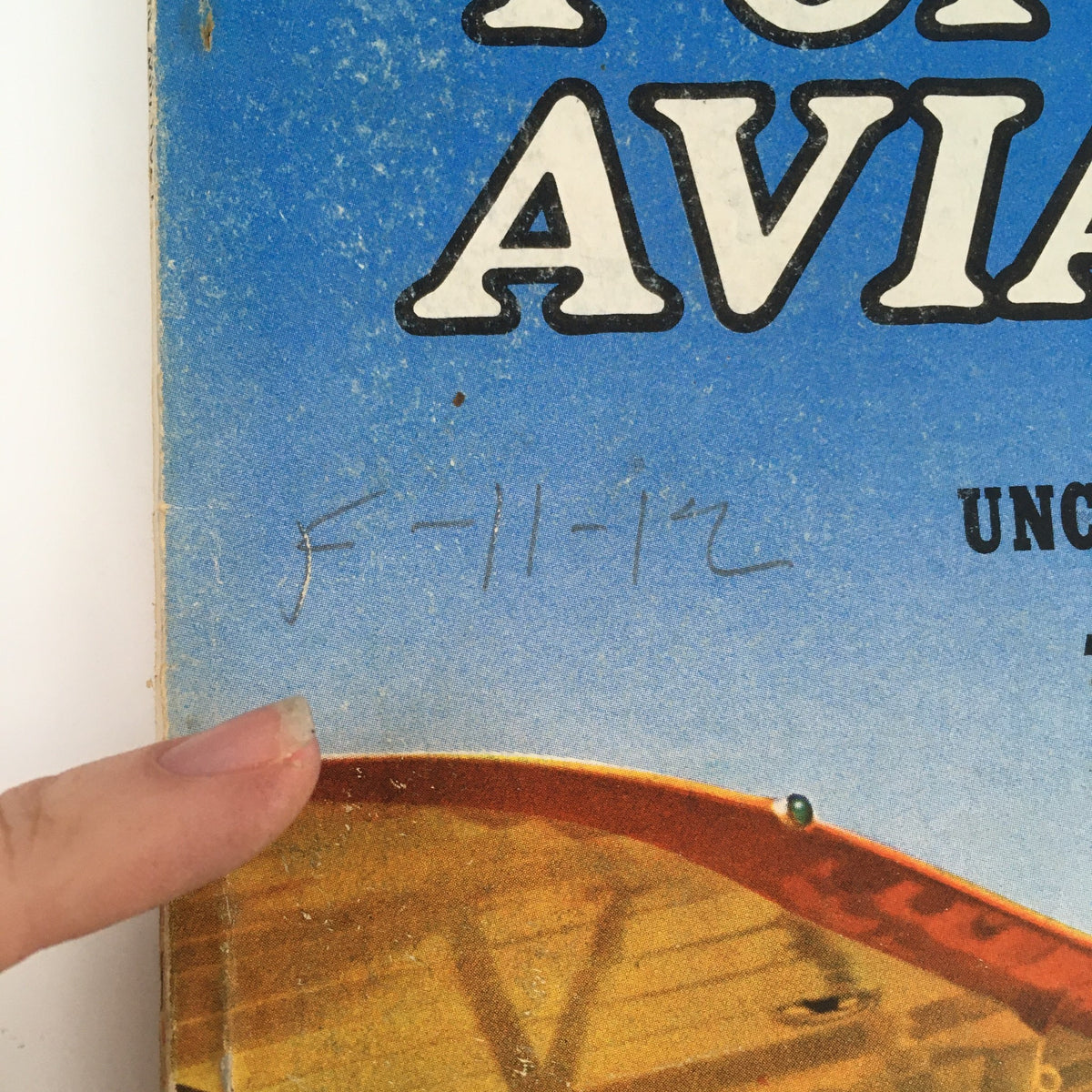 Close-up of the Popular Aviation Magazine January 1938 Vol 22 #1 cover with a handwritten note dated 'F-11-12'.