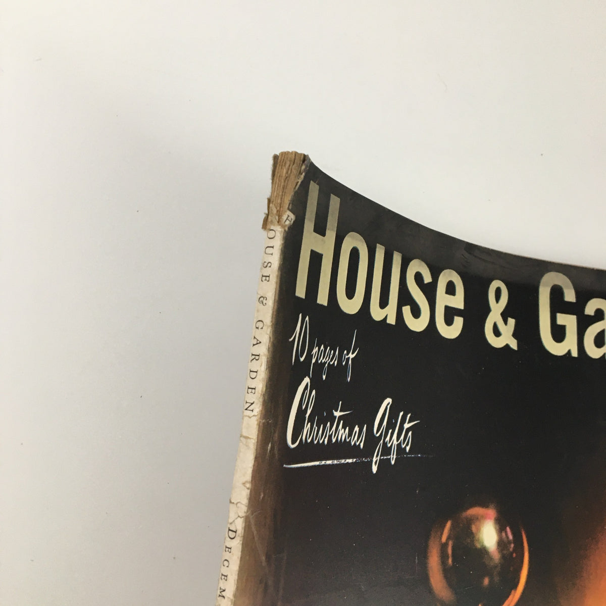 Spine detail of VTG House & Garden Magazine December 1943 demonstrating wear and charm, highlighting 10 pages of Christmas Gifts.