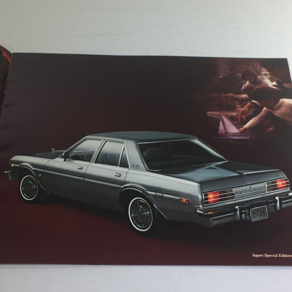 1978 Dodge Aspen Special Edition Paint Dealership Car Auto Brochure Catalog showcasing a silver Dodge Aspen from a rear angle with rear lights highlighted.