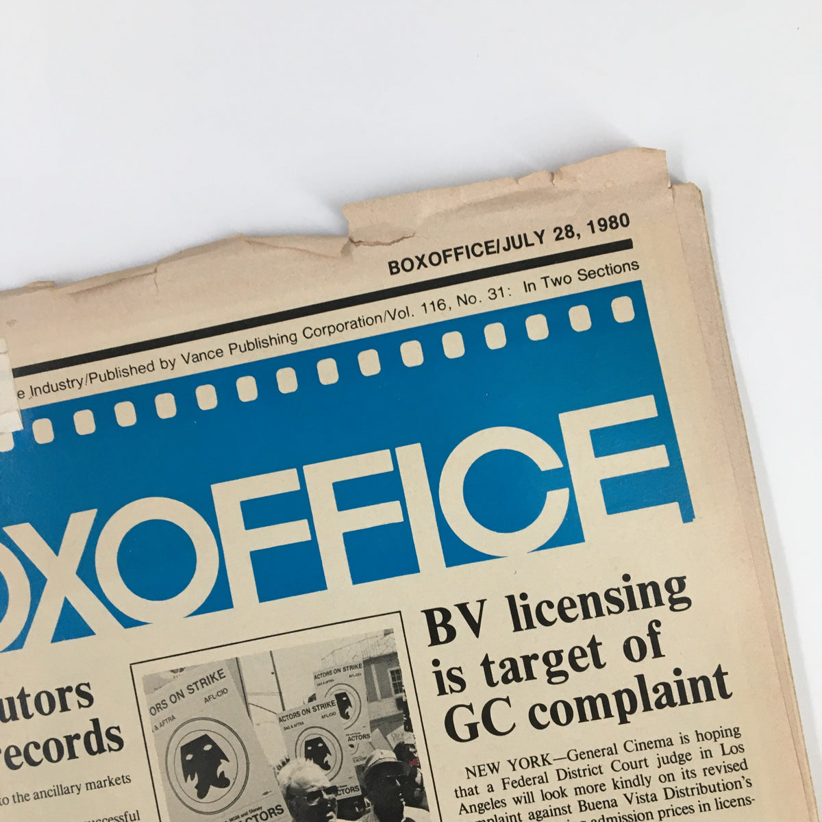 Top edge of Box Office Magazine July 28, 1980 displaying the magazine's title and date, with minor damages due to age, reinforcing its status as a vintage artifact.