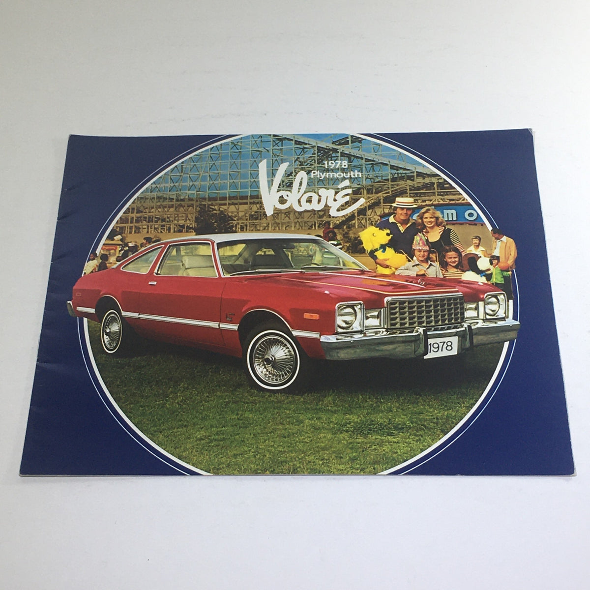 1978 Plymouth Volare Coupe Sedan Dealership Car Auto Brochure Catalog cover featuring a red Plymouth Volare car and a family in a park setting.