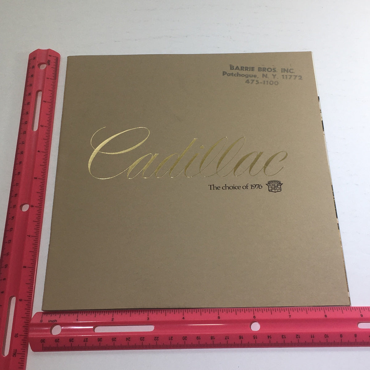 Cover of the 1976 Cadillac Seville and El Dorado Dealership Car Auto Brochure Catalog with gold lettering.