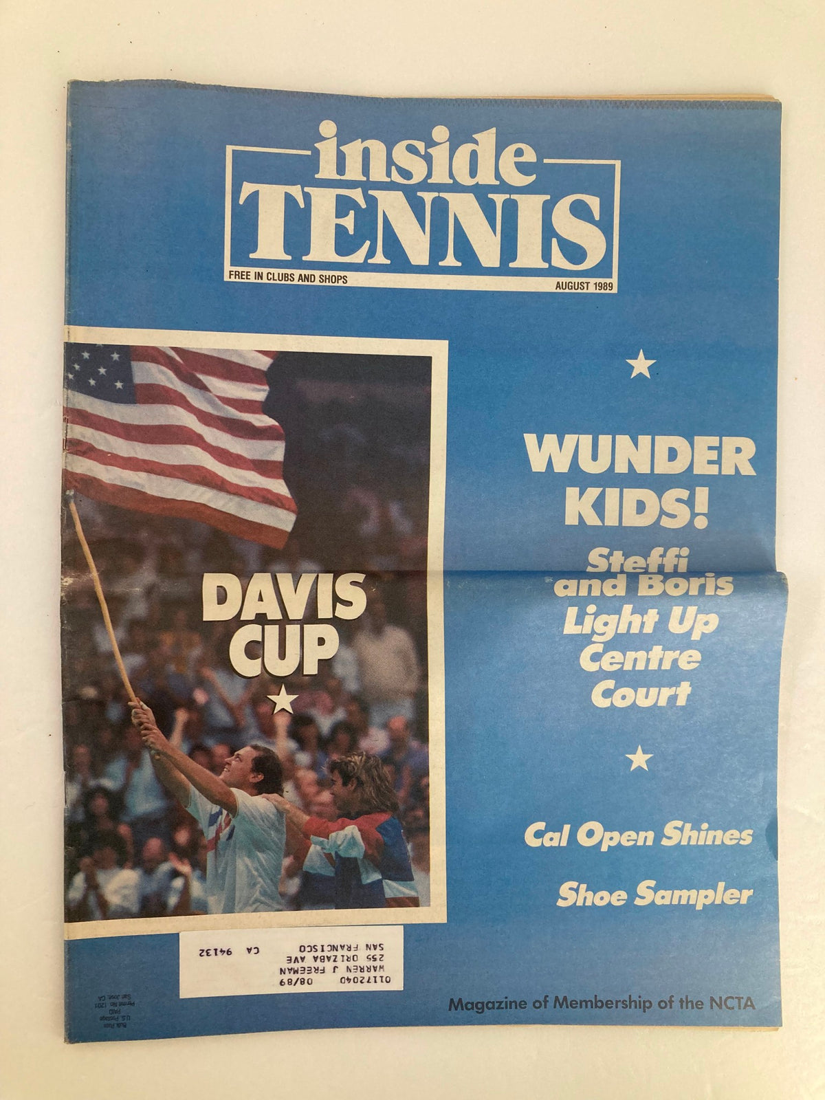 Cover of the August 1989 issue of Inside Tennis Magazine featuring Steffi Graf and Boris Becker, celebrated tennis players, showcasing their performances on the Centre Court, along with headlines about the Davis Cup and a patriotic American flag theme.