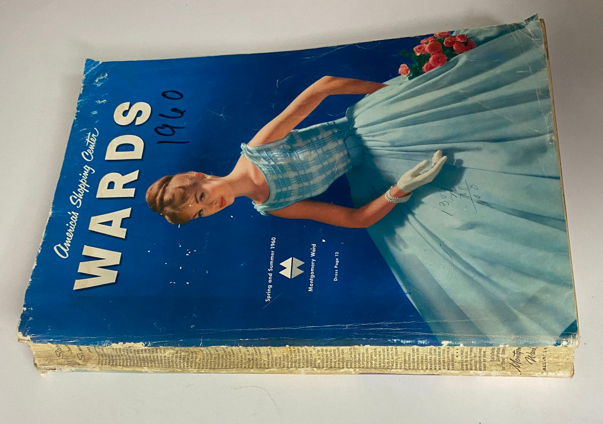 Side view of 1960 Montgomery Ward Spring and Summer Catalog showing the colorful cover and detailing of the vintage magazine.