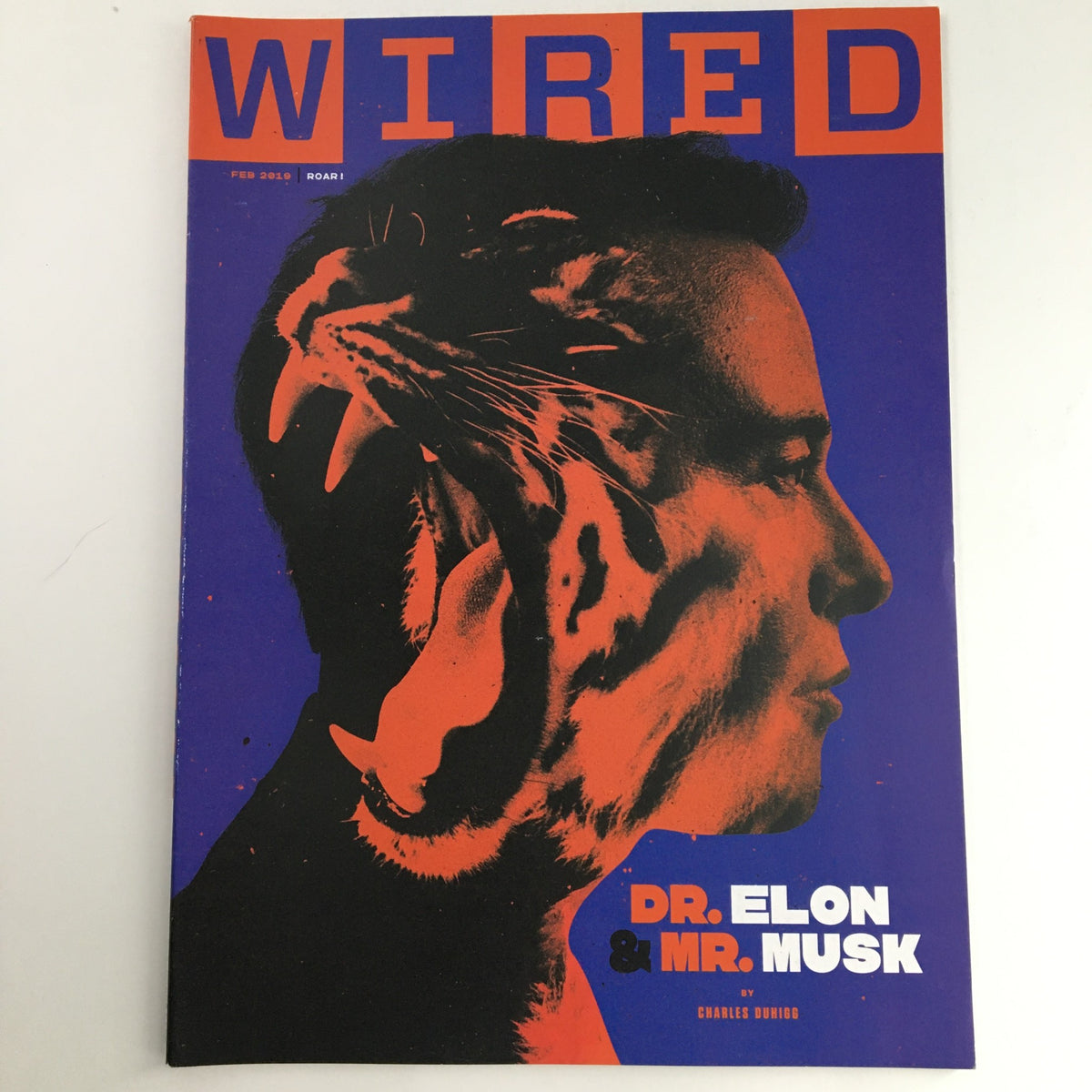Wired Magazine cover for February 2019 featuring 'Dr. Elon & Mr. Musk' by Charles Duhigg. The graphic cover displays a striking profile silhouette with vibrant colors and artistic elements, encapsulating the intrigue of the issue.