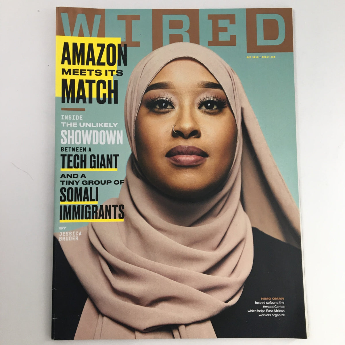 Wired Magazine December 2019 cover featuring Nimo Omar, titled 'Amazon Meets Its Match'. The issue discusses the showdown between a tech giant and a small group of Somali immigrants, illustrated with a powerful portrait.