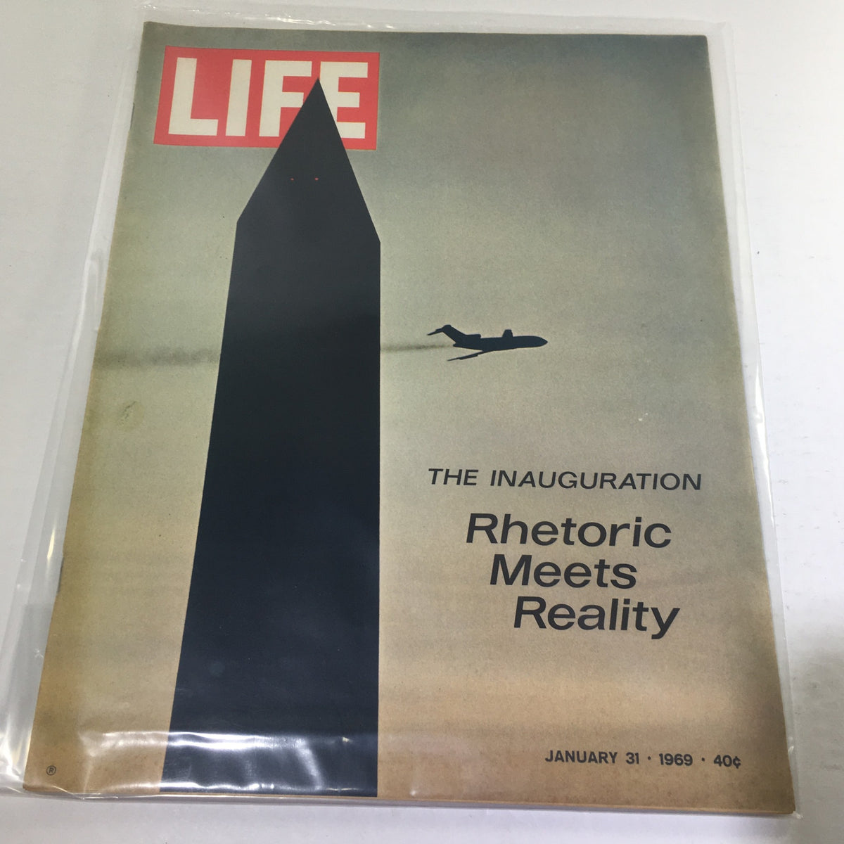Cover of Life Magazine dated January 31, 1969, featuring the title 'The Inauguration Rhetoric Meets Reality', showcasing an illustration of a monument with an airplane flying above, reflecting a significant moment in American history.