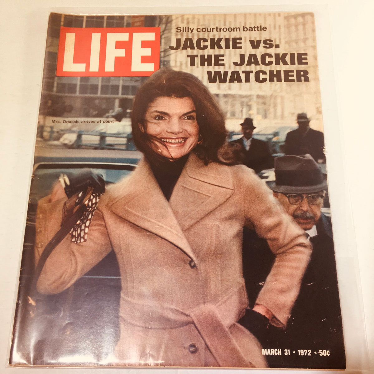 Vintage Life Magazine cover from March 31, 1972, featuring the title 'Jackie vs. The Jackie Watcher' with an image of Jackie Onassis smiling in a stylish coat.