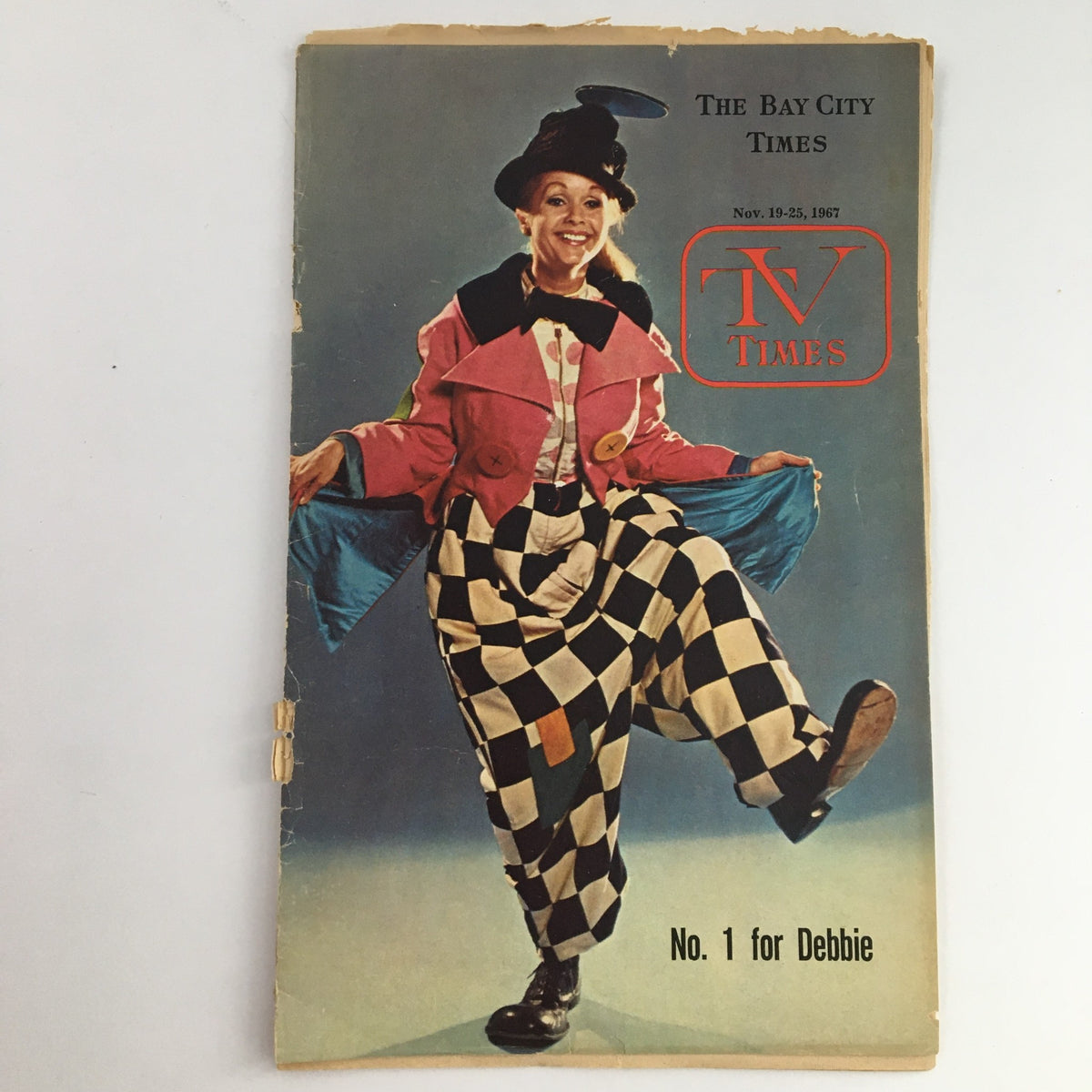 Cover of TV Times from Bay City, Michigan, dated November 19-25, 1967, featuring a colorful clown outfit and the title 'No. 1 for Debbie Reynolds', showcasing vintage television nostalgia.