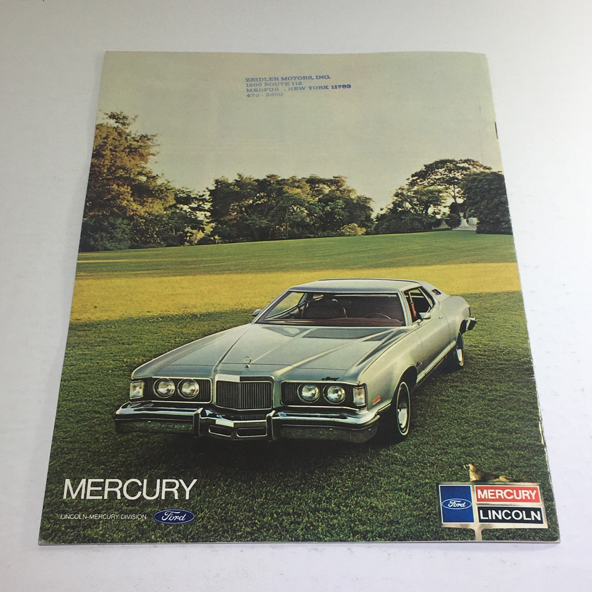Cover of the Mercury brochure from 1975 featuring a vintage Mercury Cougar car set against a lush green background.