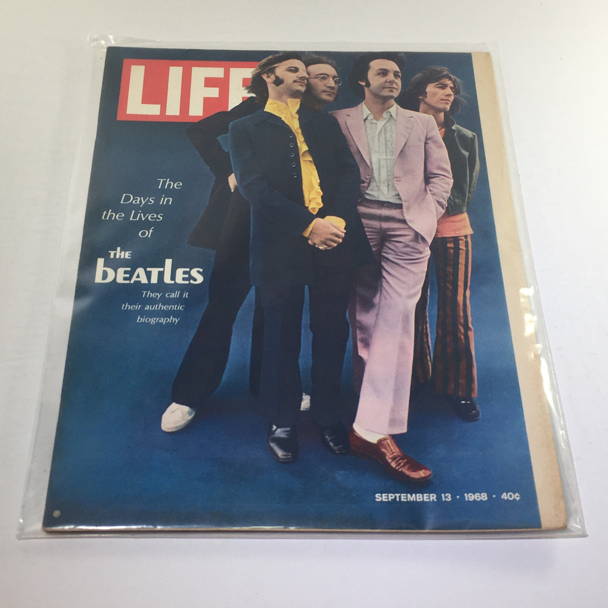 Cover of VTG Life Magazine September 13 1968 titled 'Days in the Lives of The Beatles', showcasing the iconic band members dressed in colorful outfits against a blue background, highlighting their cultural impact in the 1960s.
