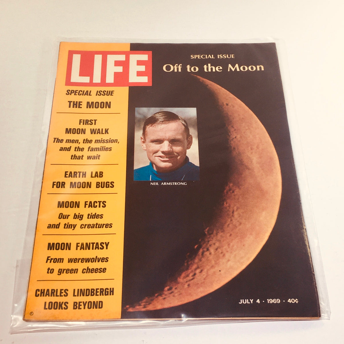 Vintage Life Magazine cover from July 4, 1969, featuring Neil Armstrong under the title 'Off To The Moon,' with moon visuals and articles on moon facts and the first moon walk.
