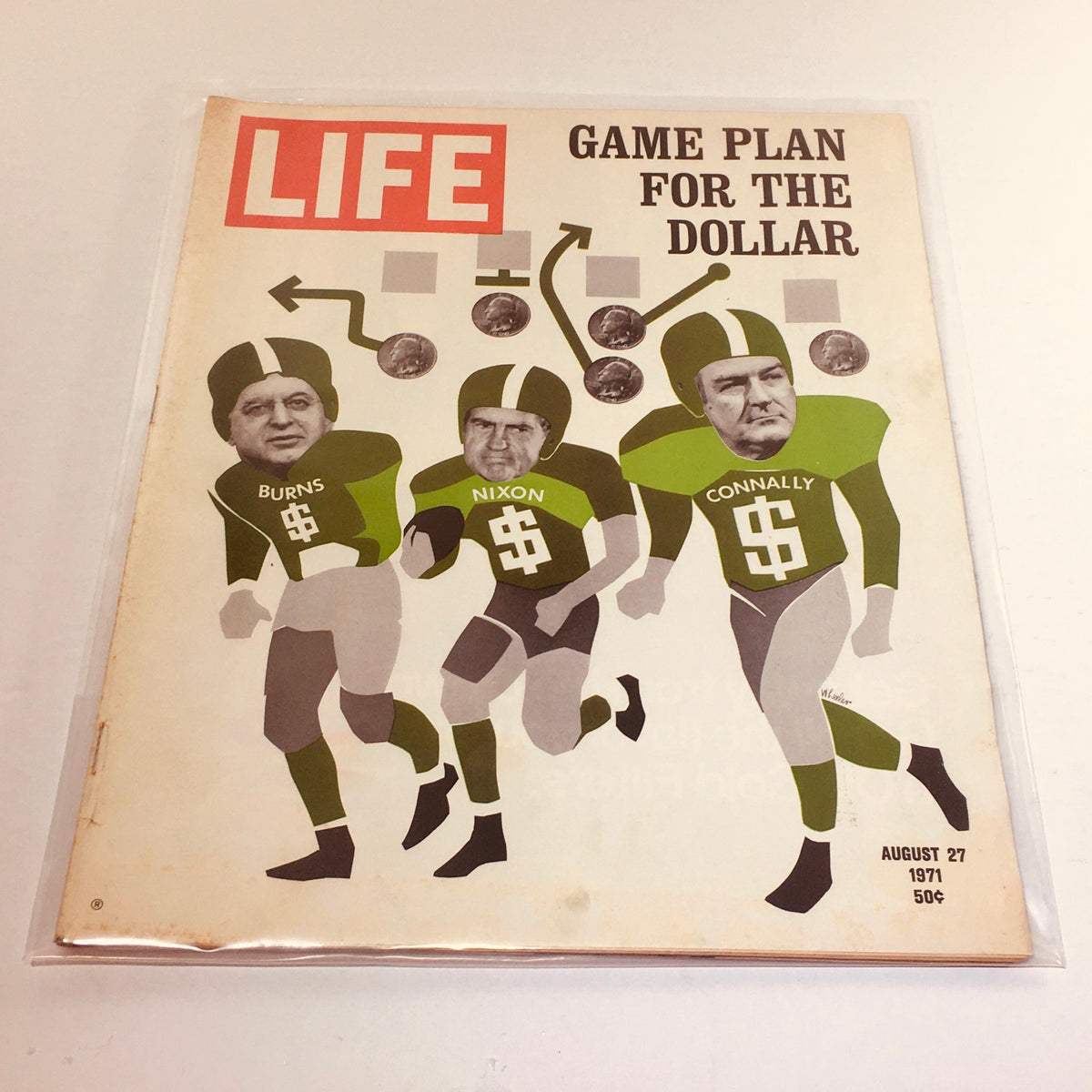 Vintage Life Magazine cover from August 27, 1971 featuring the title 'Game Plan For The Dollar,' illustrating three figures dressed in football uniforms with the names Burns, Nixon, and Connally, symbolizing economic strategies in a creative design.