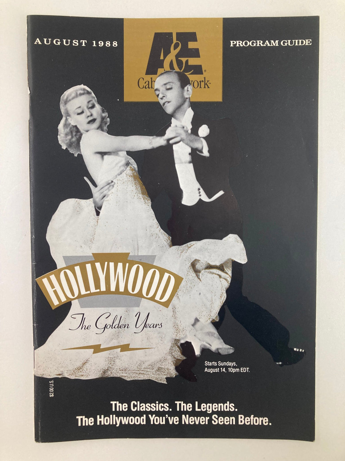 Cover of VTG A&E Cable Network Program Guide August 1988 titled 'Hollywood: The Golden Years', featuring a classic dance scene with actors. Iconic vintage design highlights the programming of that era.
