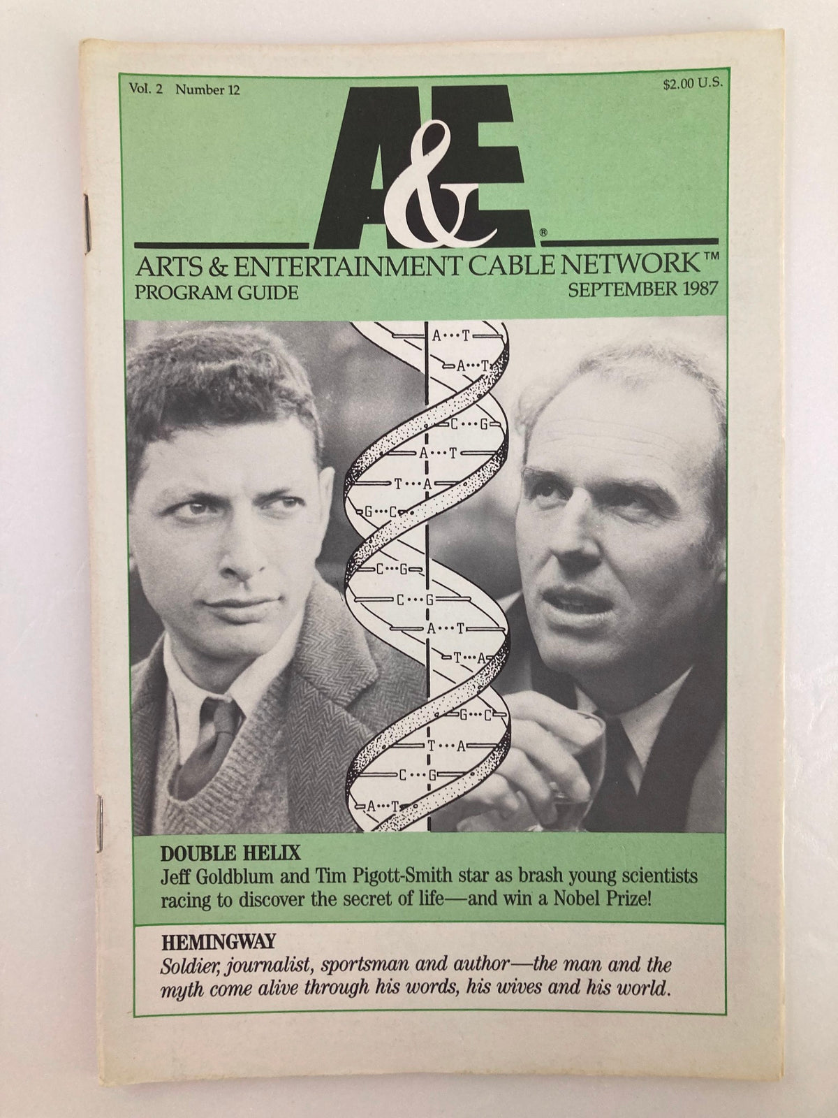 Cover of the VTG A&E Cable Network Program Guide from September 1987, Vol 2 #12, featuring the titles 'DOUBLE HELIX' and 'HEMINGWAY'. The design includes a DNA helix graphic and images of two male figures, reflecting cultural programming trends of the late 1980s.