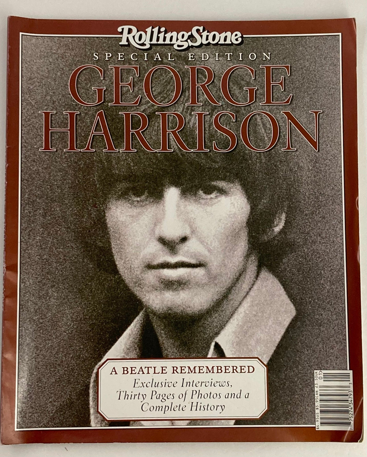 Cover image of Rolling Stone Magazine Special Edition 2001 featuring George Harrison, showcasing his iconic portrait with the text 'A Beatle Remembered' and details about exclusive interviews and history.