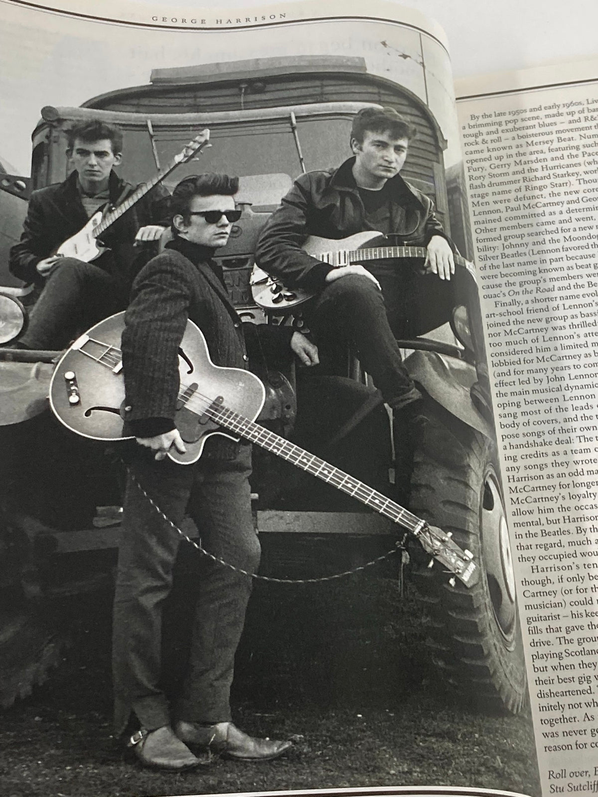 Image of George Harrison with bandmates during the early Beatles days, captured in the Rolling Stone Magazine Special Edition 2001, highlighting his role in the iconic band.