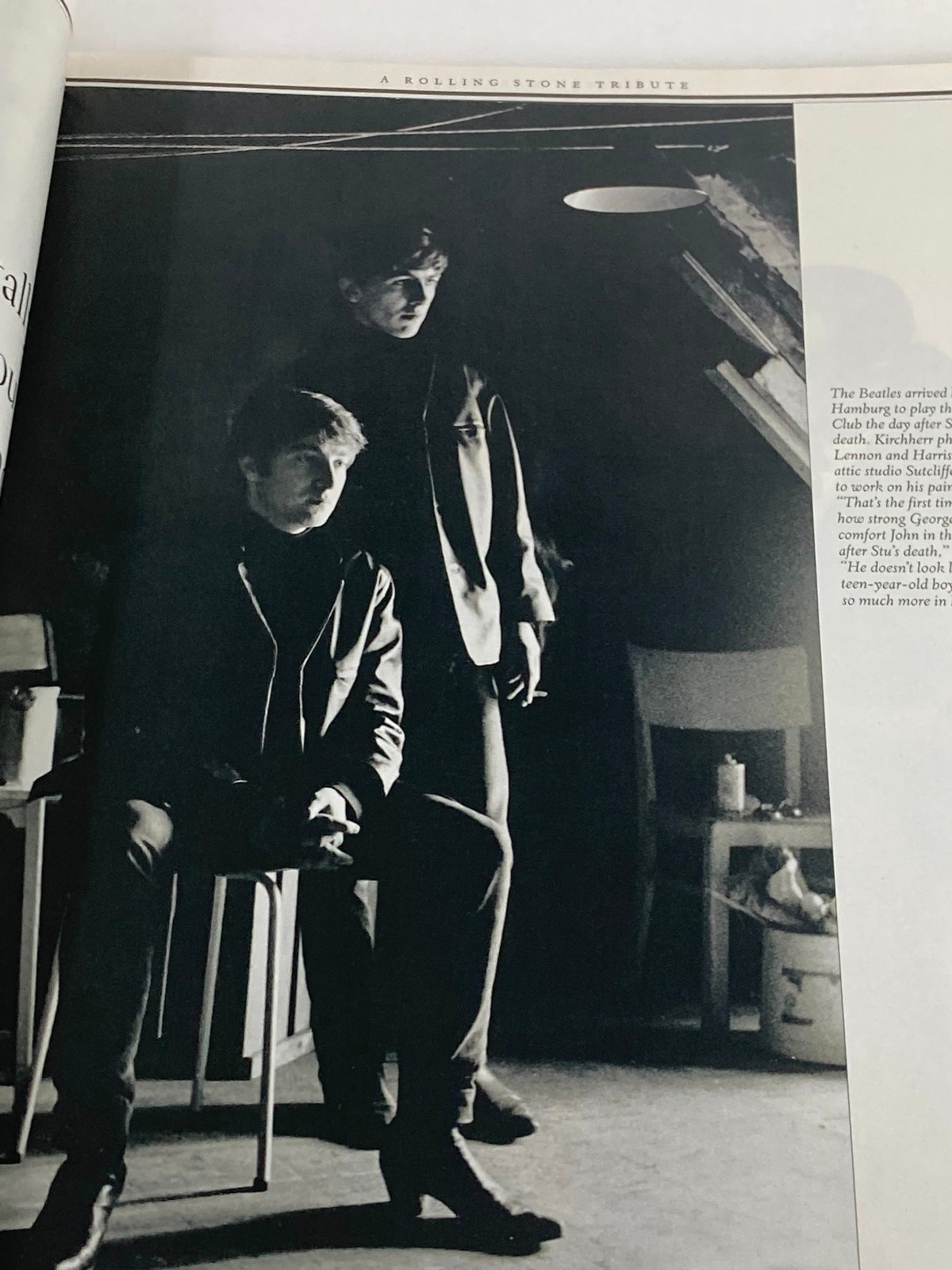 Inside view of Rolling Stone Magazine special edition 2001 featuring George Harrison, showcasing a black and white photograph of two individuals in a dramatic lighting setting.
