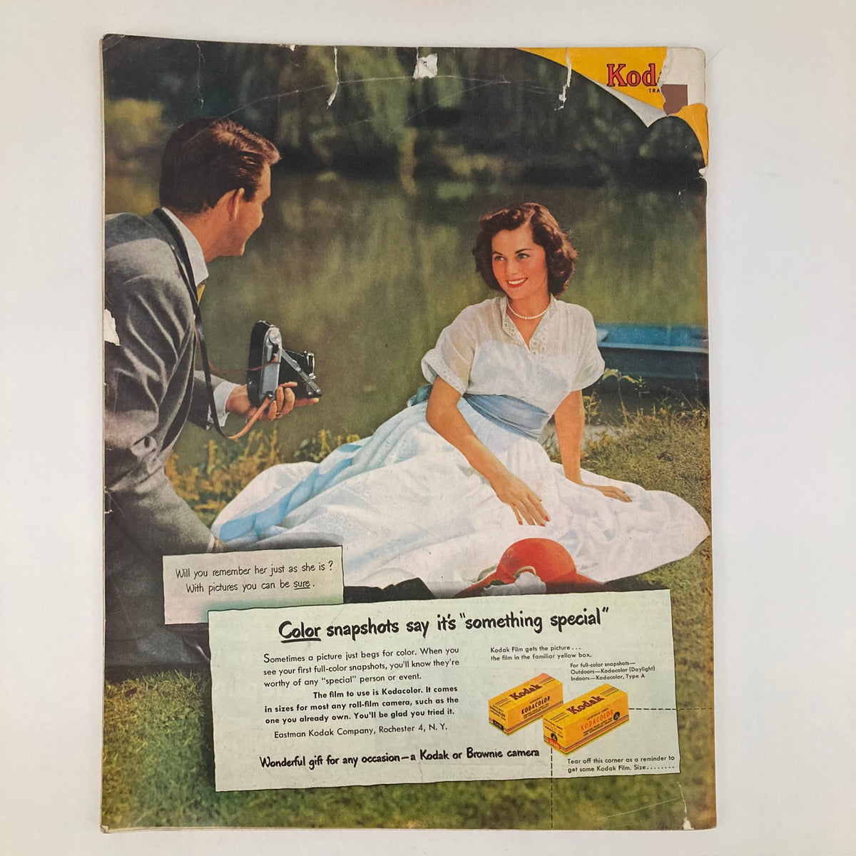 Back cover of the Saturday Evening Post Magazine, April 15, 1950, featuring an illustration by John Clymer. The design includes a Kodak advertisement and an image of a couple by the water.