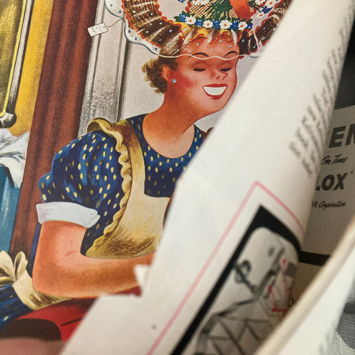Close-up view of the cover illustration from the Saturday Evening Post Magazine April 8, 1950, showcasing a woman smiling with a decorative hat.